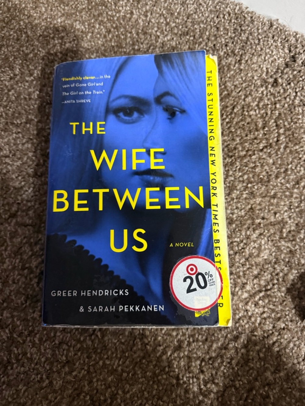 The Wife Between Us - Blue & Yellow Hardcover Novel